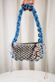 Nots friday sling bag in blue and grey reflective