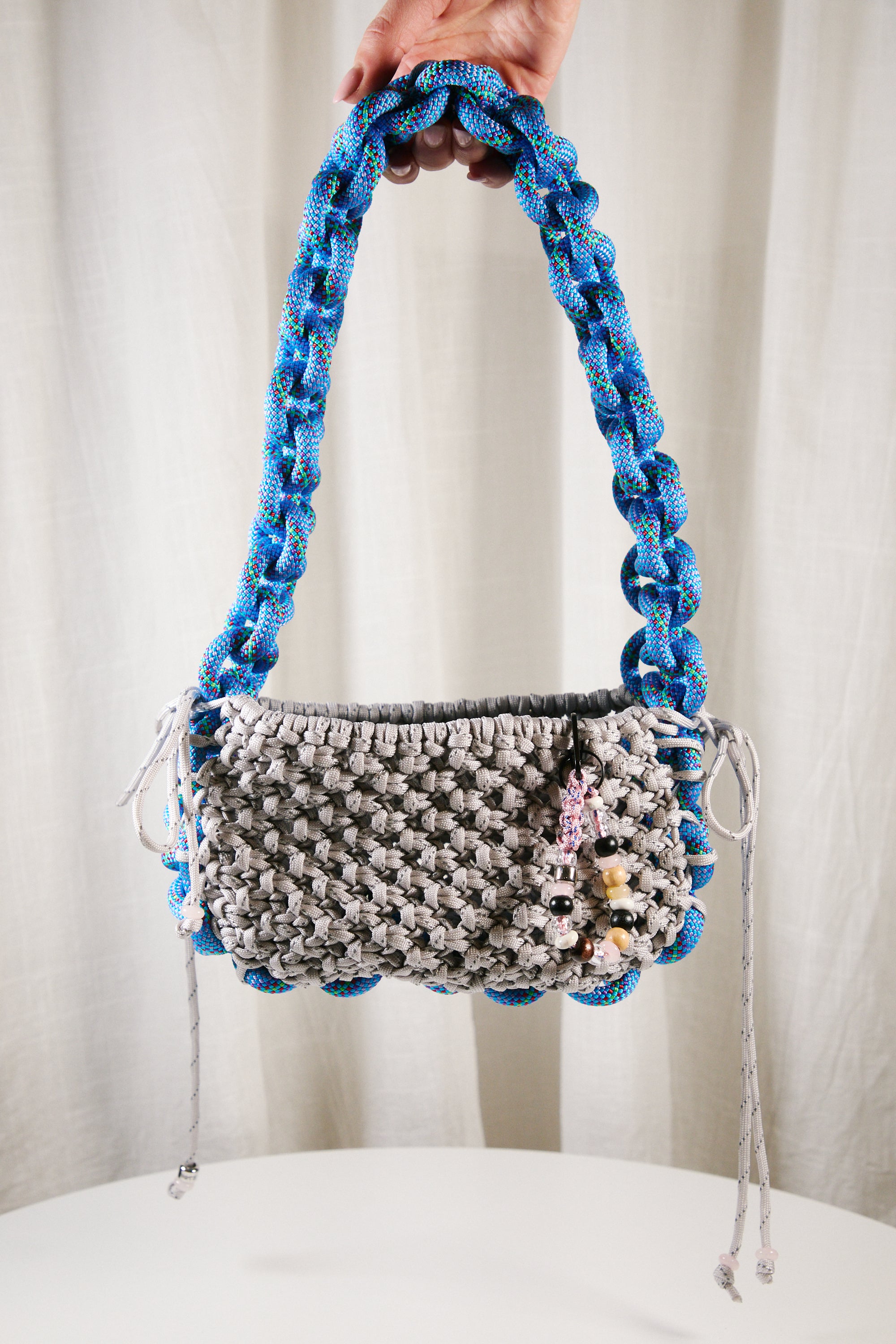 Nots friday sling bag in blue and grey reflective
