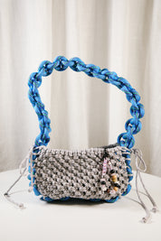 Nots friday sling bag in blue and grey reflective