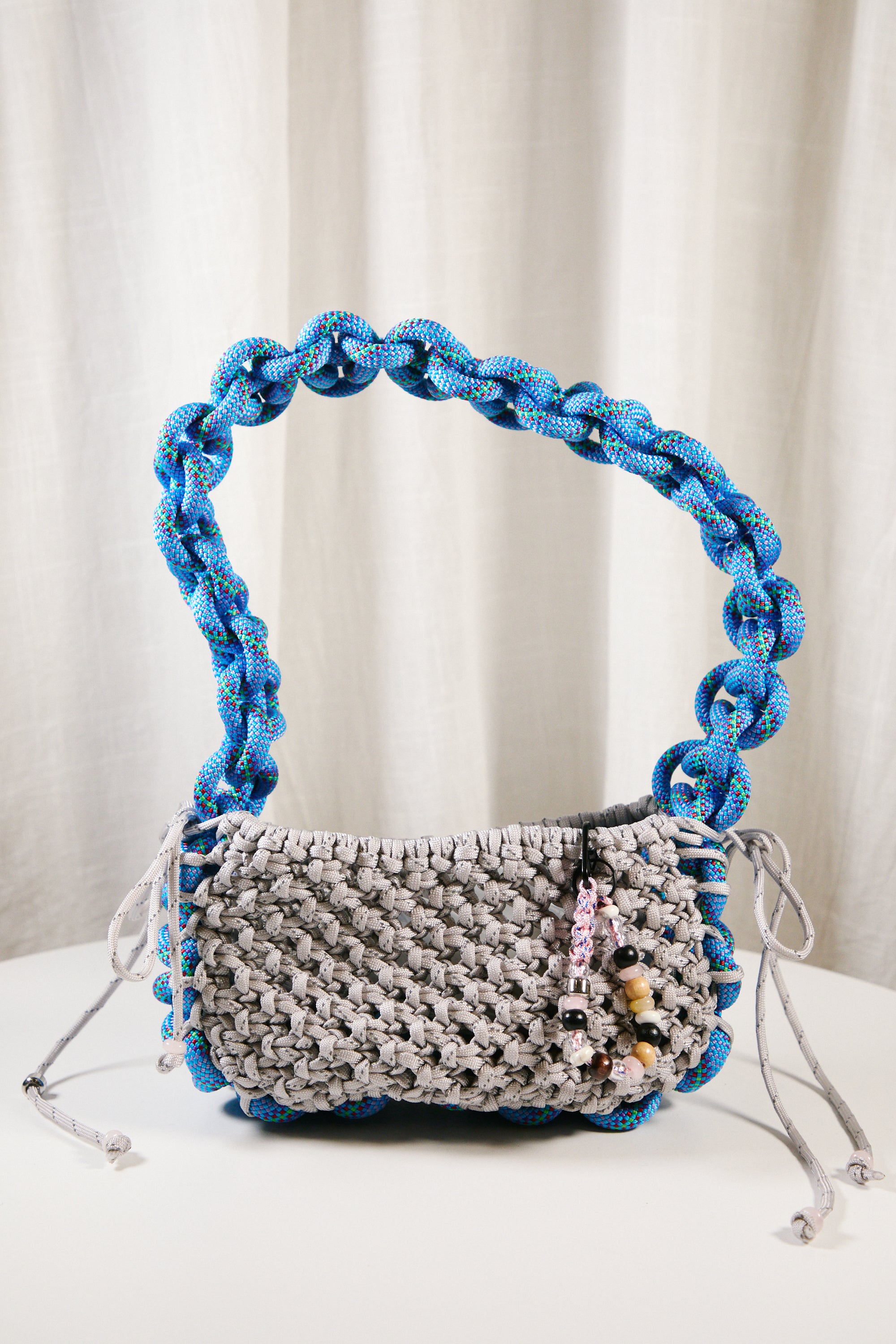 Nots friday sling bag in blue and grey reflective