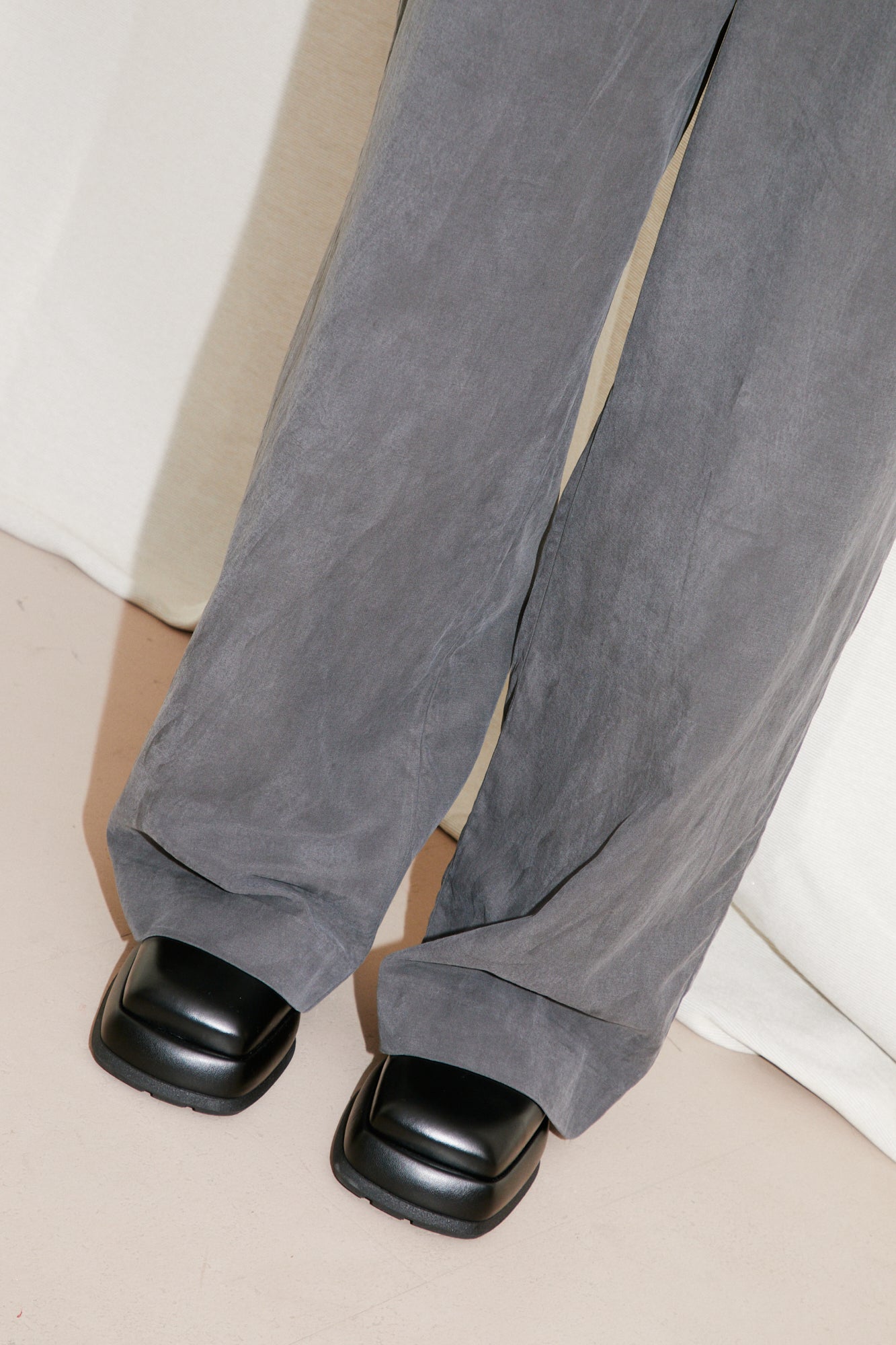 black to grey daruma trousers with miista coral shoes