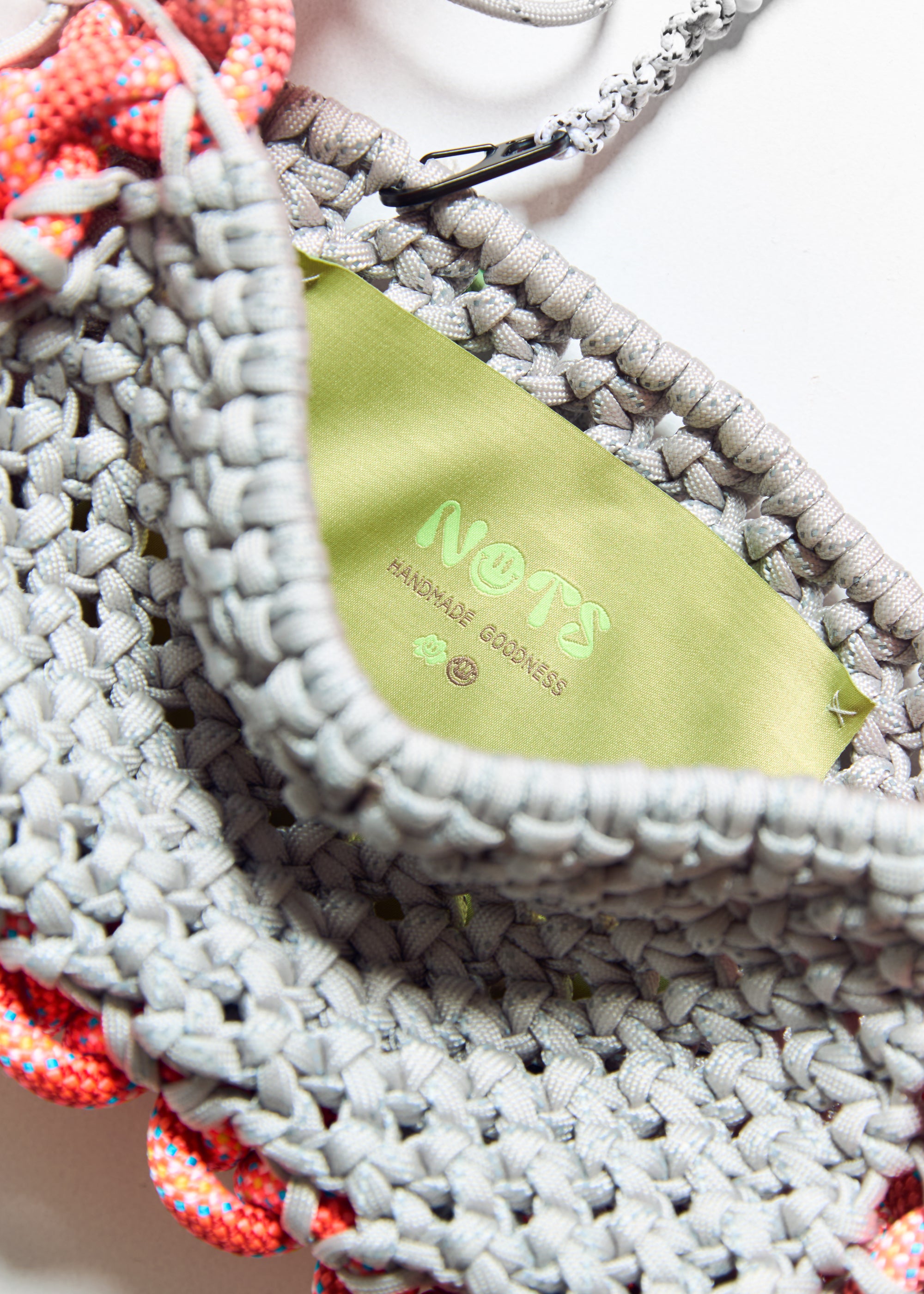 nots friday bag in coral and grey reflective