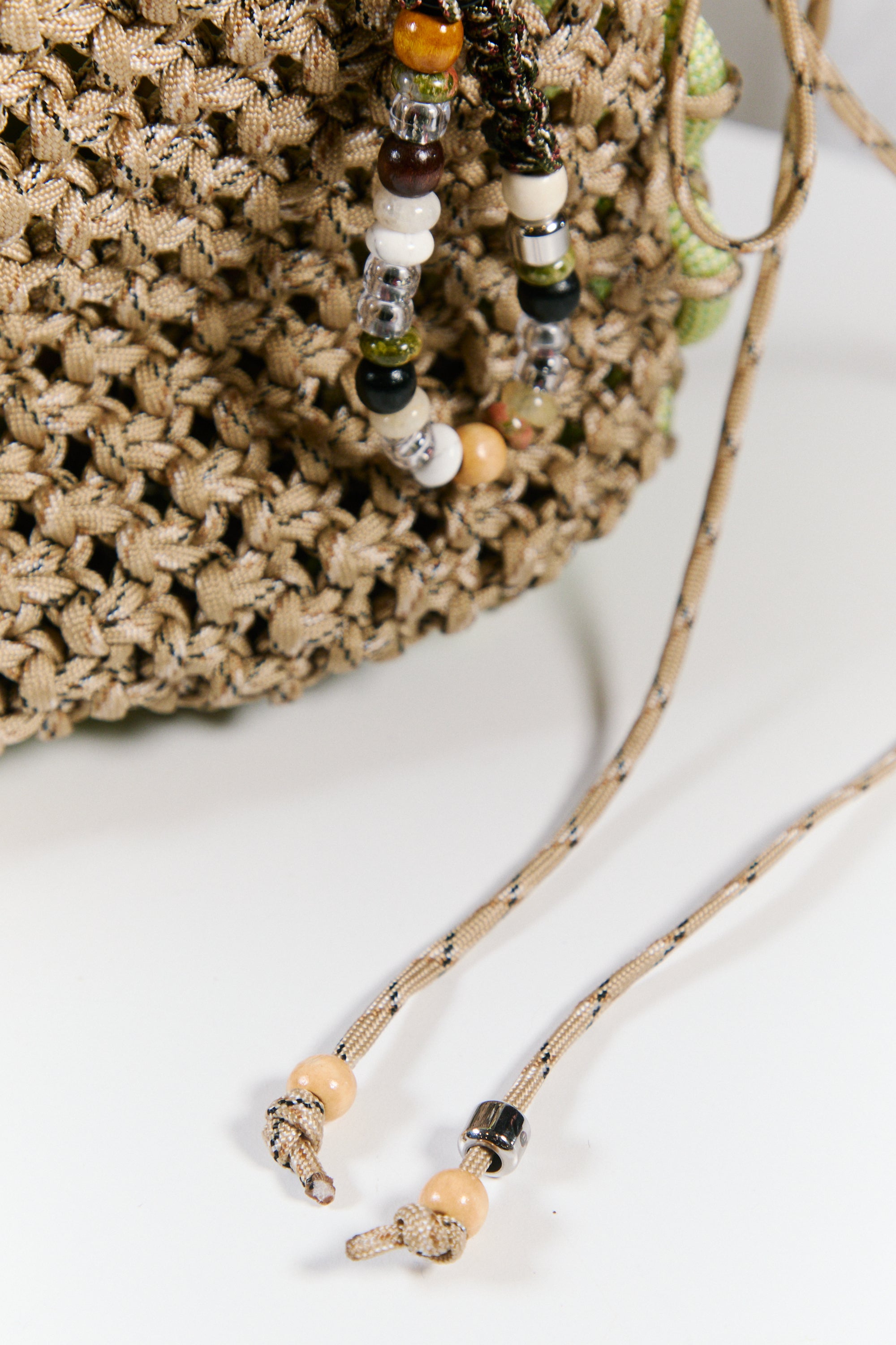 Nots friday sling bag in green and beige 
