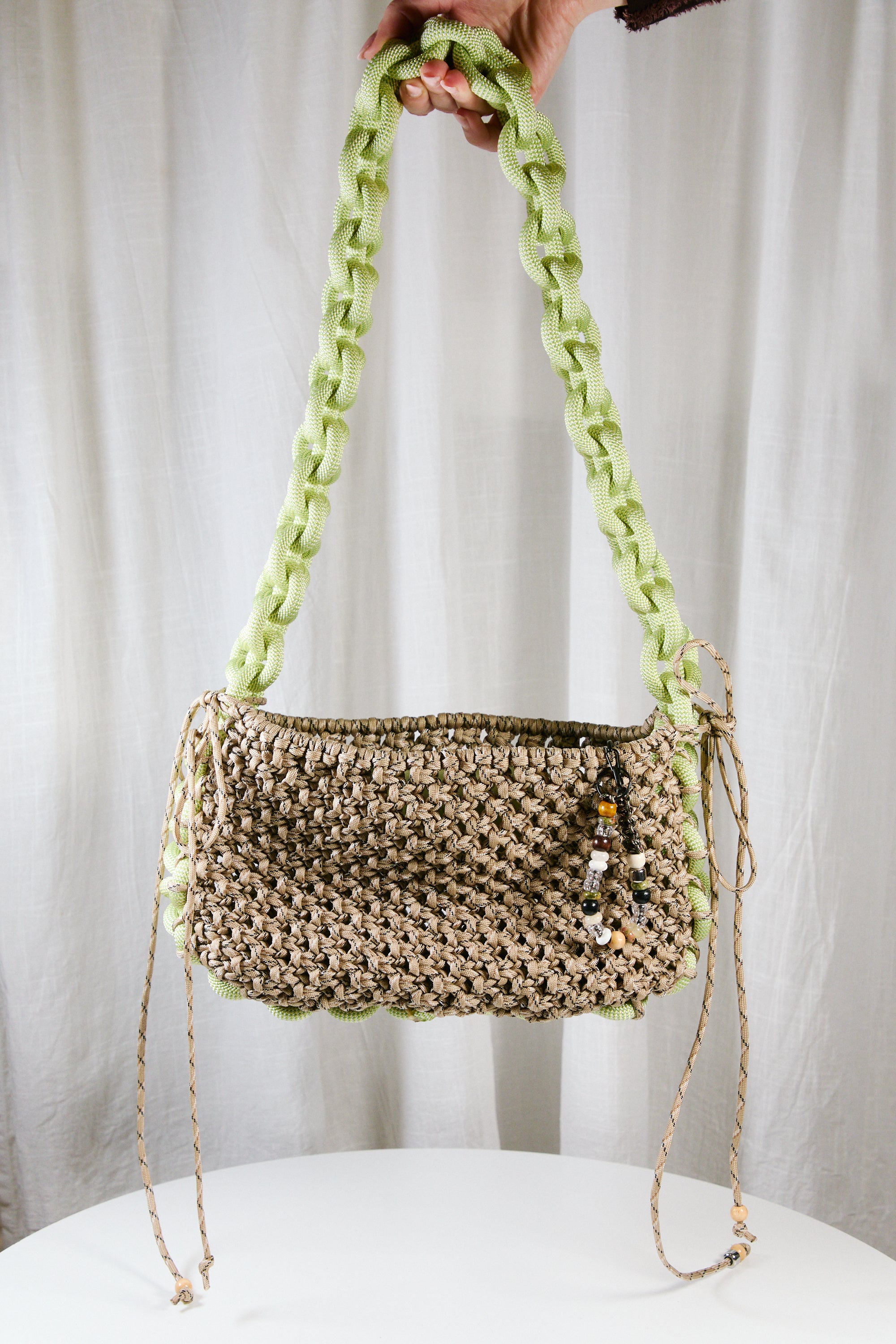 Nots friday sling bag in green and beige 