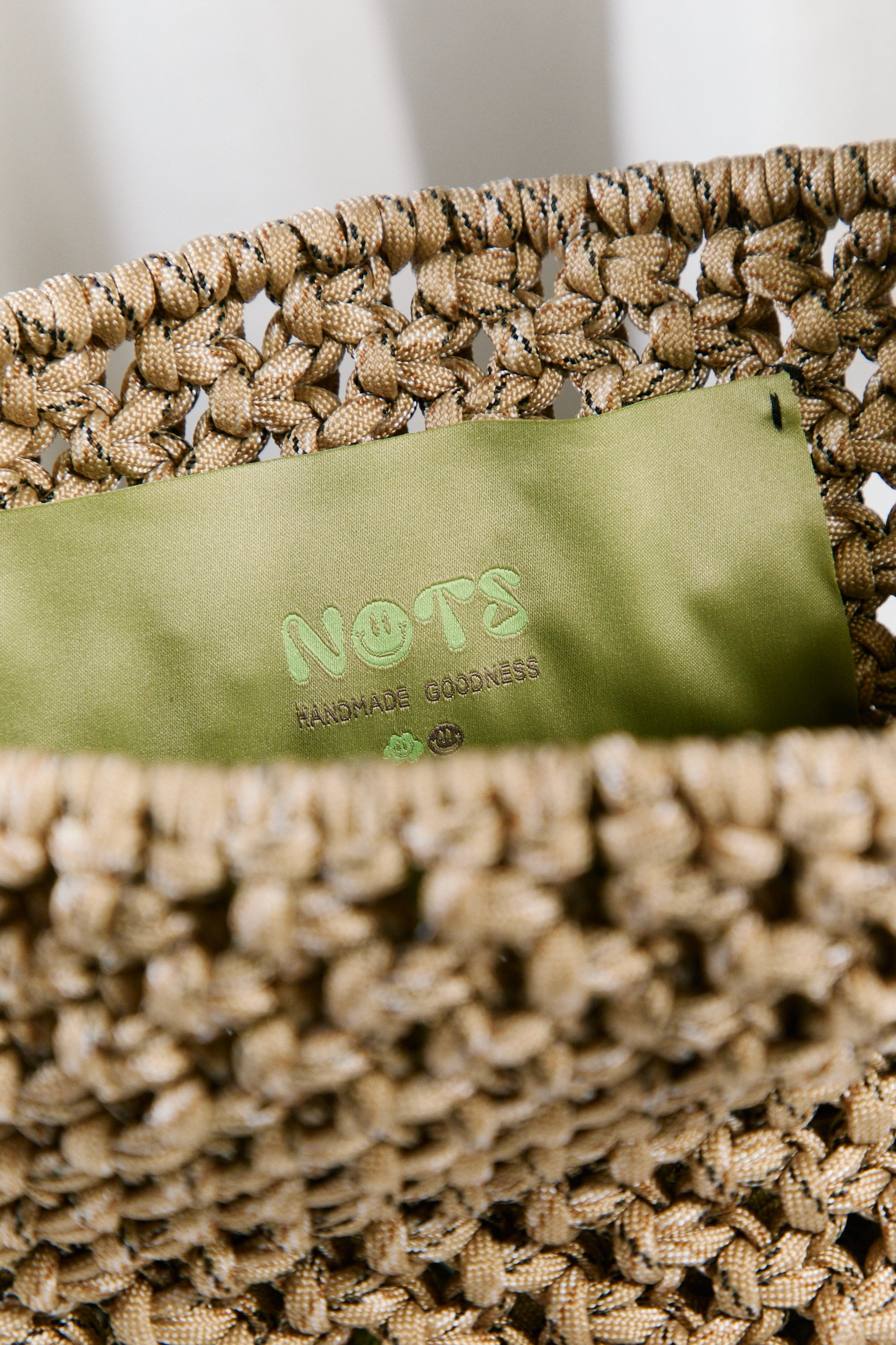 Nots friday sling bag in green and beige 