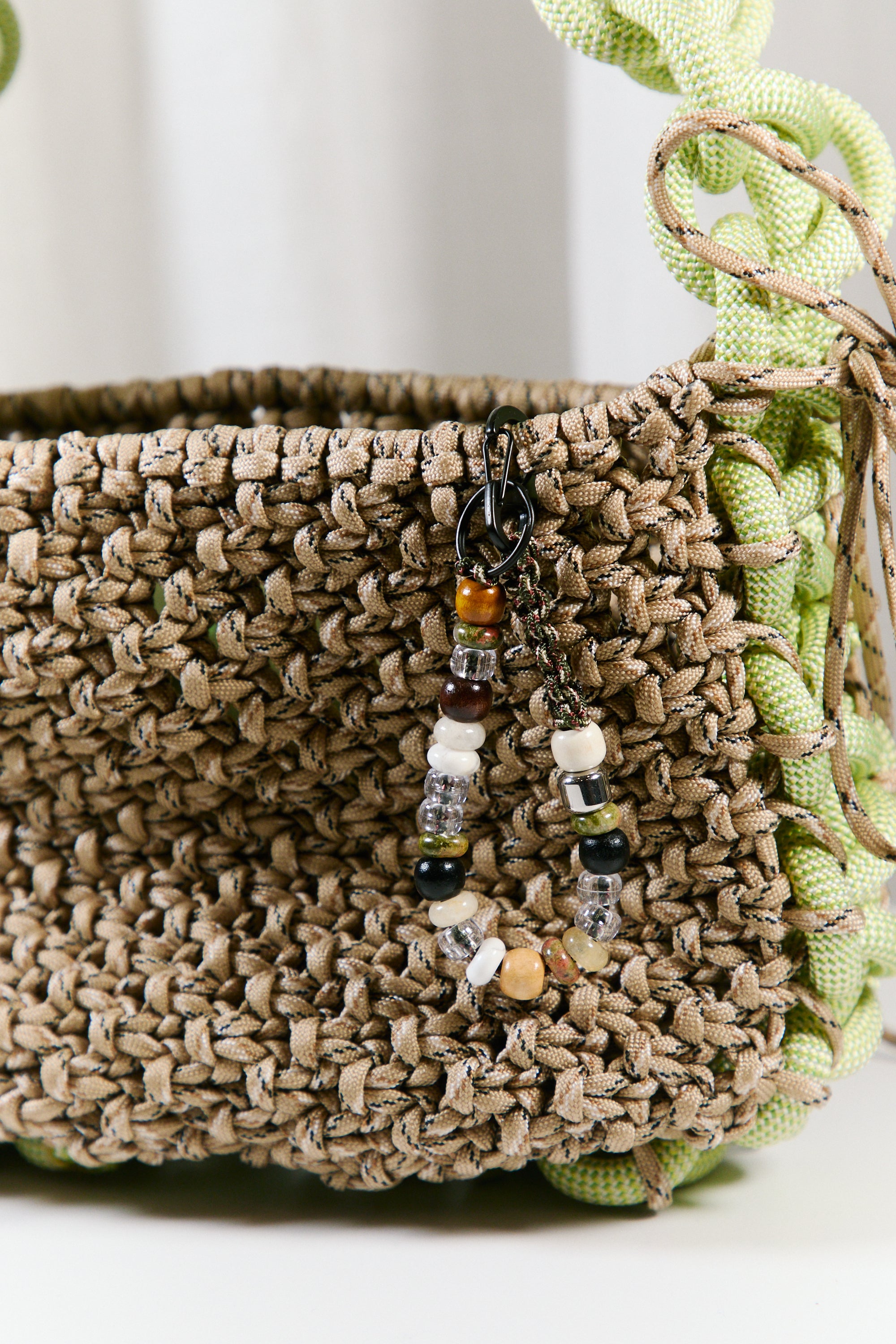 Nots friday sling bag in green and beige 