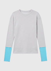 A light gray long-sleeve crewneck top with contrasting light blue cuffs, displayed flat against a light gray background.